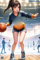 A girl holding a basketball on a basketball court.